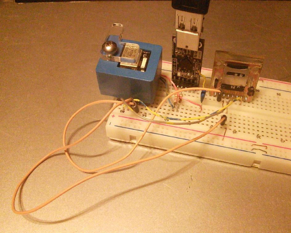 RFDpogo Fixture with RFD22301 SMD device mounted in prototype breadboard